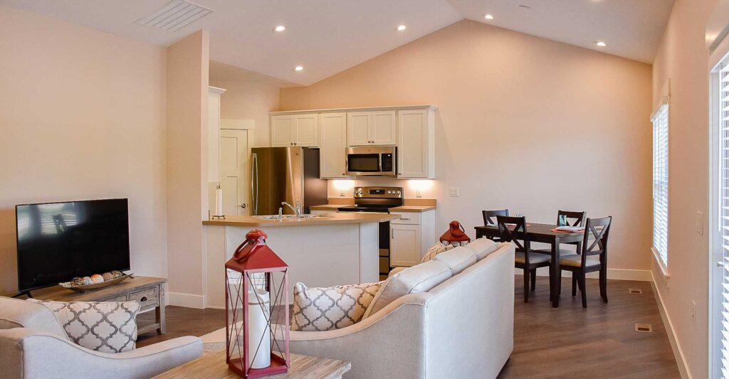 The Pines at Southfield Village in South Bend, IN, Douglas model, view of living room, kitchen & dining area The Pines at Southfield Village in South Bend, IN, Douglas model, view of living room, kitchen & dining area