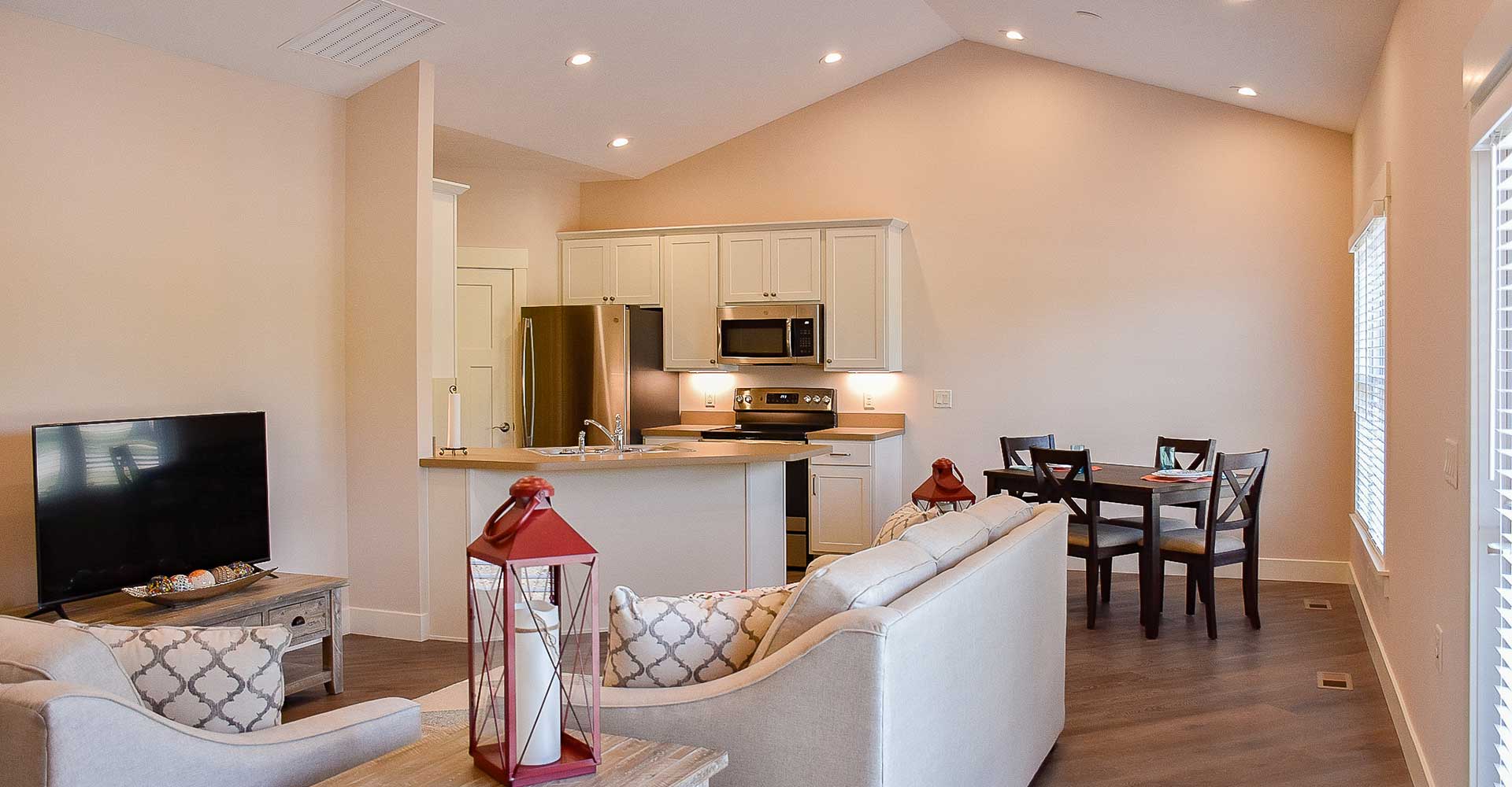 The Pines at Southfield Village in South Bend, IN, Douglas model, view of living room, kitchen & dining area